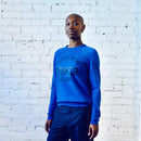 Unisex crew neck sweatshirt in royal blue with "Power of Love" graphic