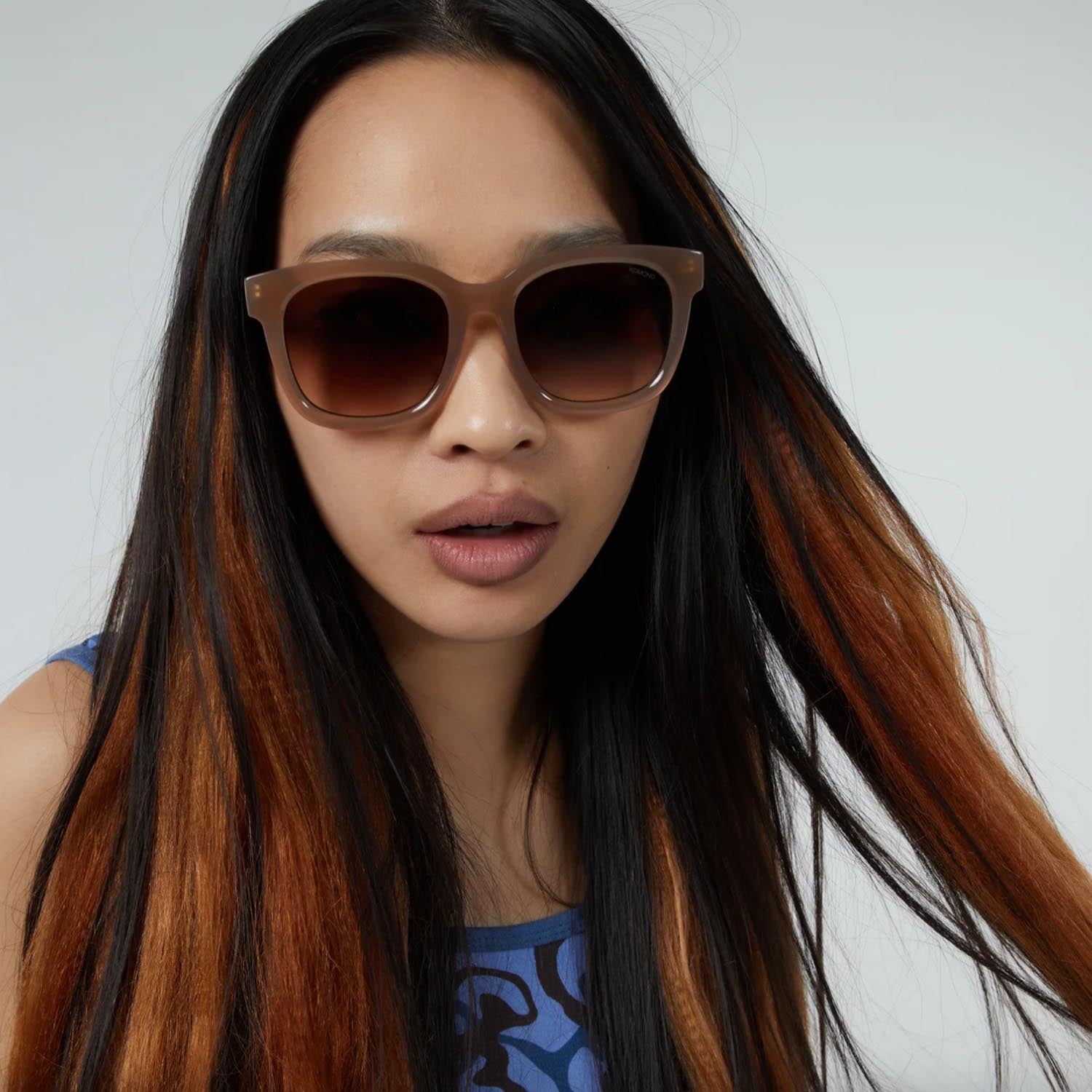 Sienna tan glasses on model.