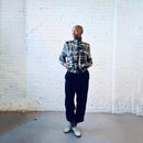 Model wearing a vintage silk bomber jacket with multi-square pattern.
