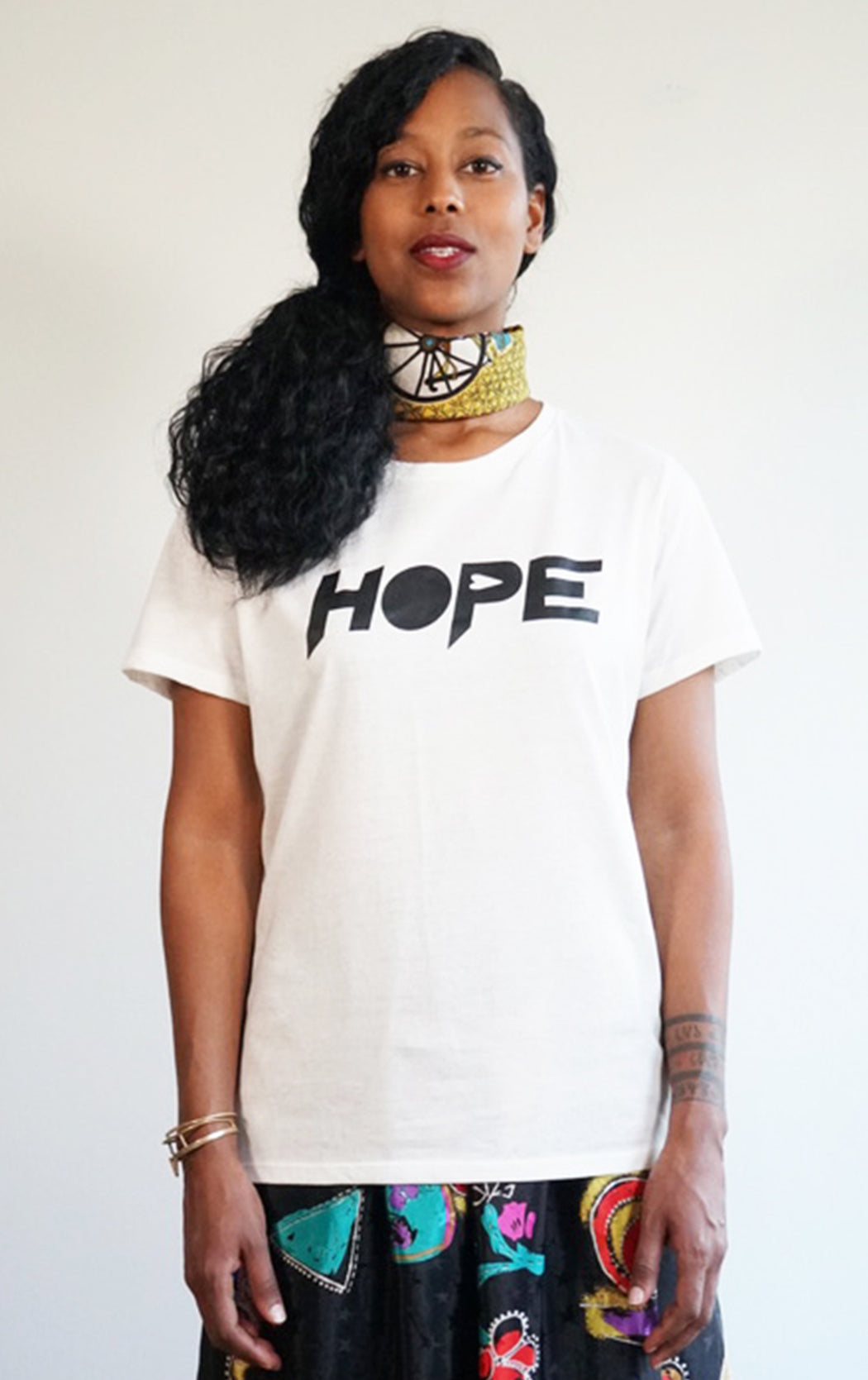 white tee with super soft hope print graphic Tshirt in a cool crew neck style made in a soft cotton blend with hope graphic on front 